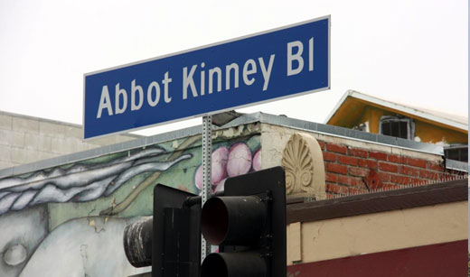 A street sign on the corner of abbot kinney blvd.