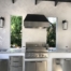 A large outdoor kitchen with stainless steel appliances.